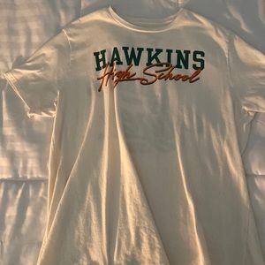 Front: “Hawkins Highschool” Back: “ Year of the Tiger, Hawkins Highschool ‘86”